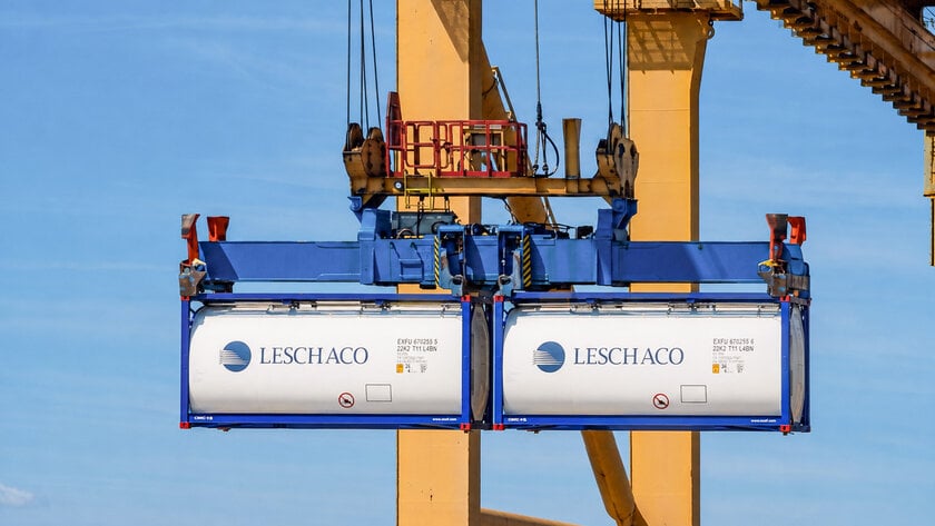 Leschaco tank containers being lifted by a container crane at a port terminal