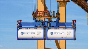 Leschaco tank containers being lifted by a container crane at a port terminal