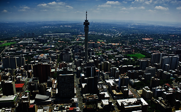 South Africa: Aerial panorama of Johannesburg with many skyscrapers and a wireless tower